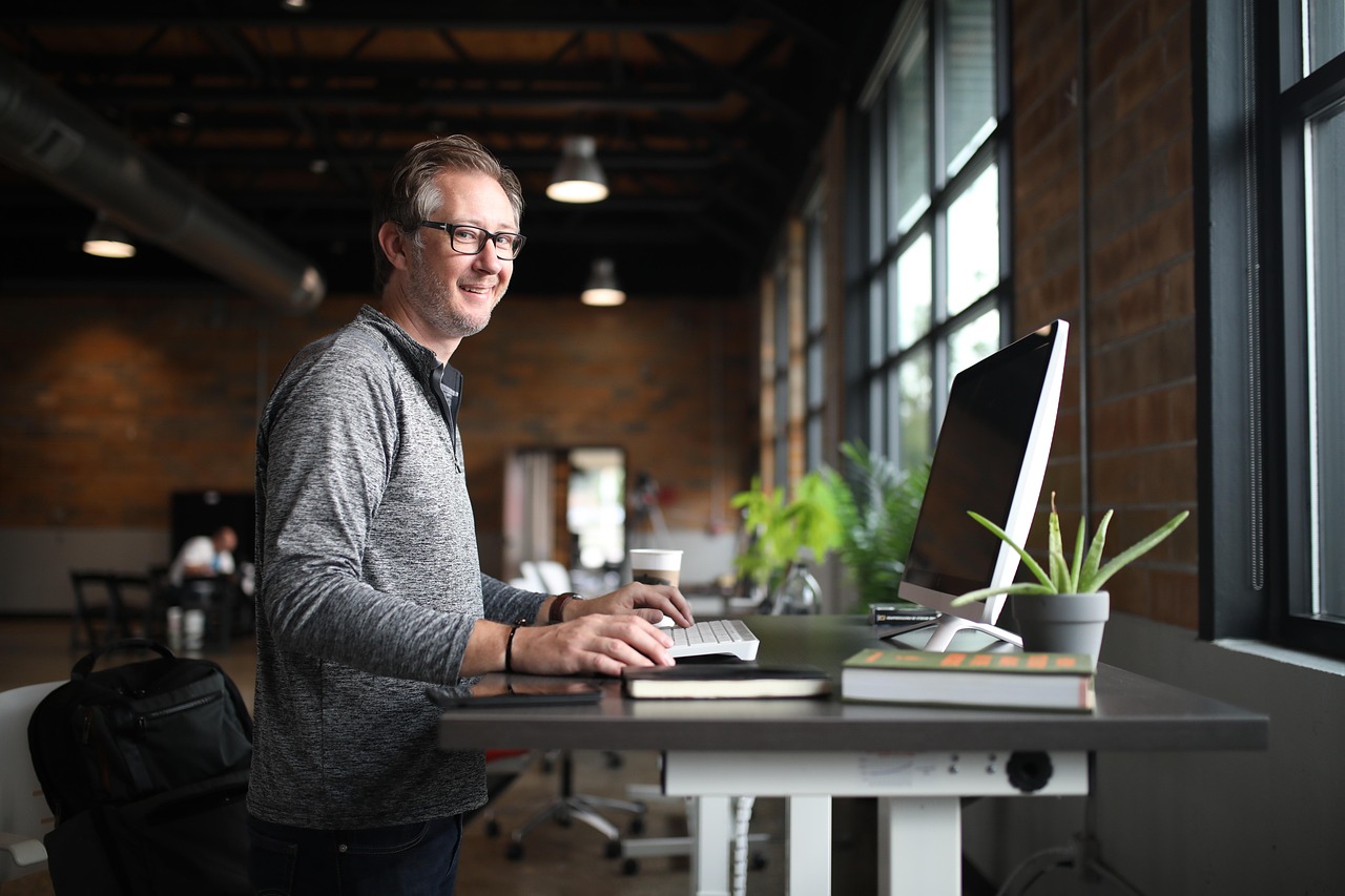 Office desk, man, business — 8 Check Benefits of Magnetic Ink Character Recognition (MICR)