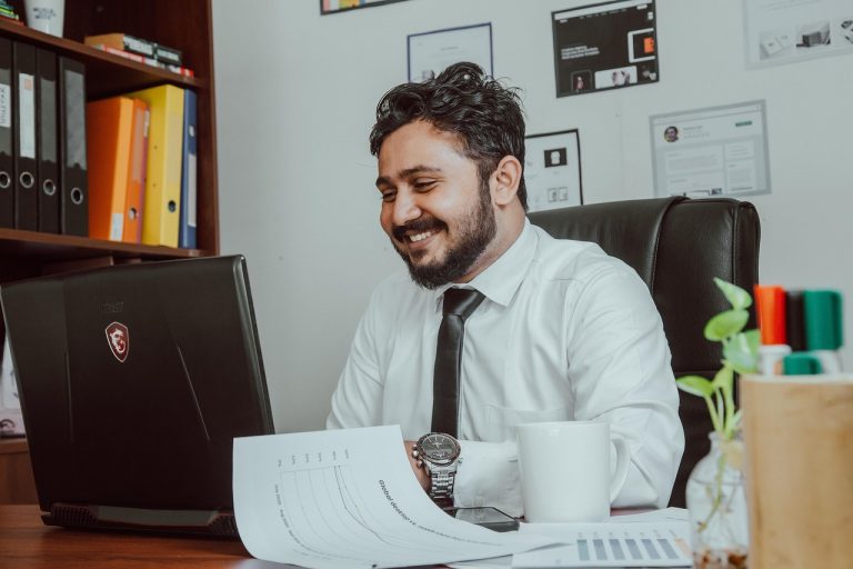 Man, office, businessman — 9 Considerations for Outsourcing Your Healthcare Call Center