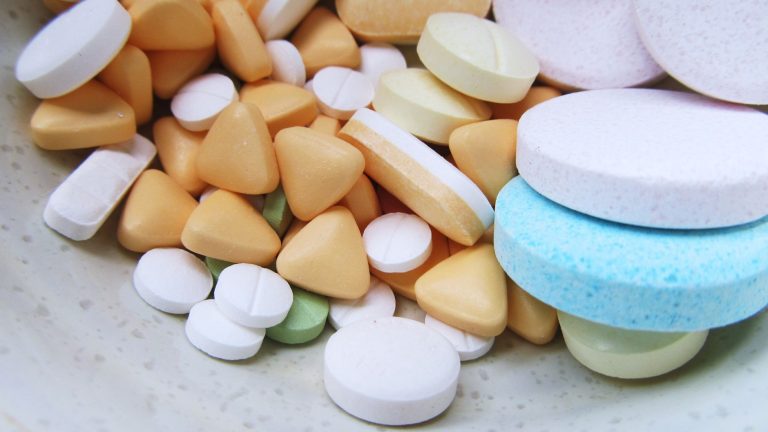 Close-up image of various colorful pills and tablets on a neutral surface. — Discover Premium Health Solutions with Hemi Phar