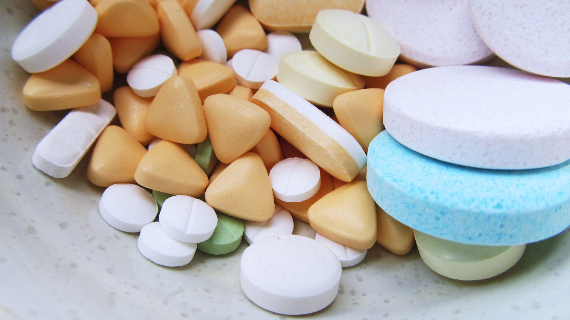 Close-up image of various colorful pills and tablets on a neutral surface. — Discover Premium Health Solutions with Hemi Phar