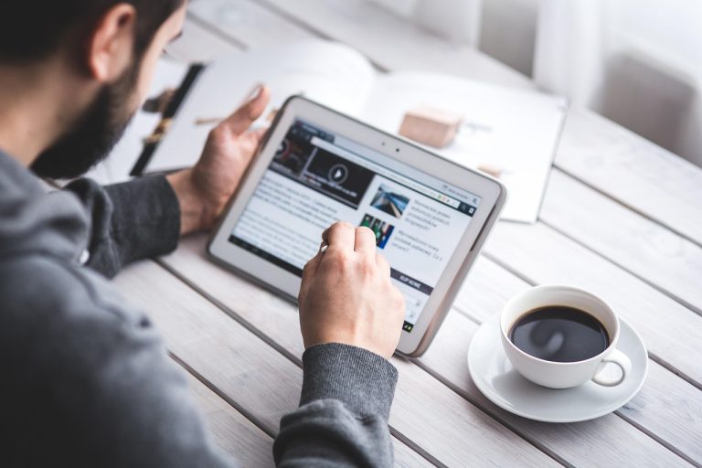 Man, reading, touchscreen — Empower The Marketing Efforts With Clickfunnels