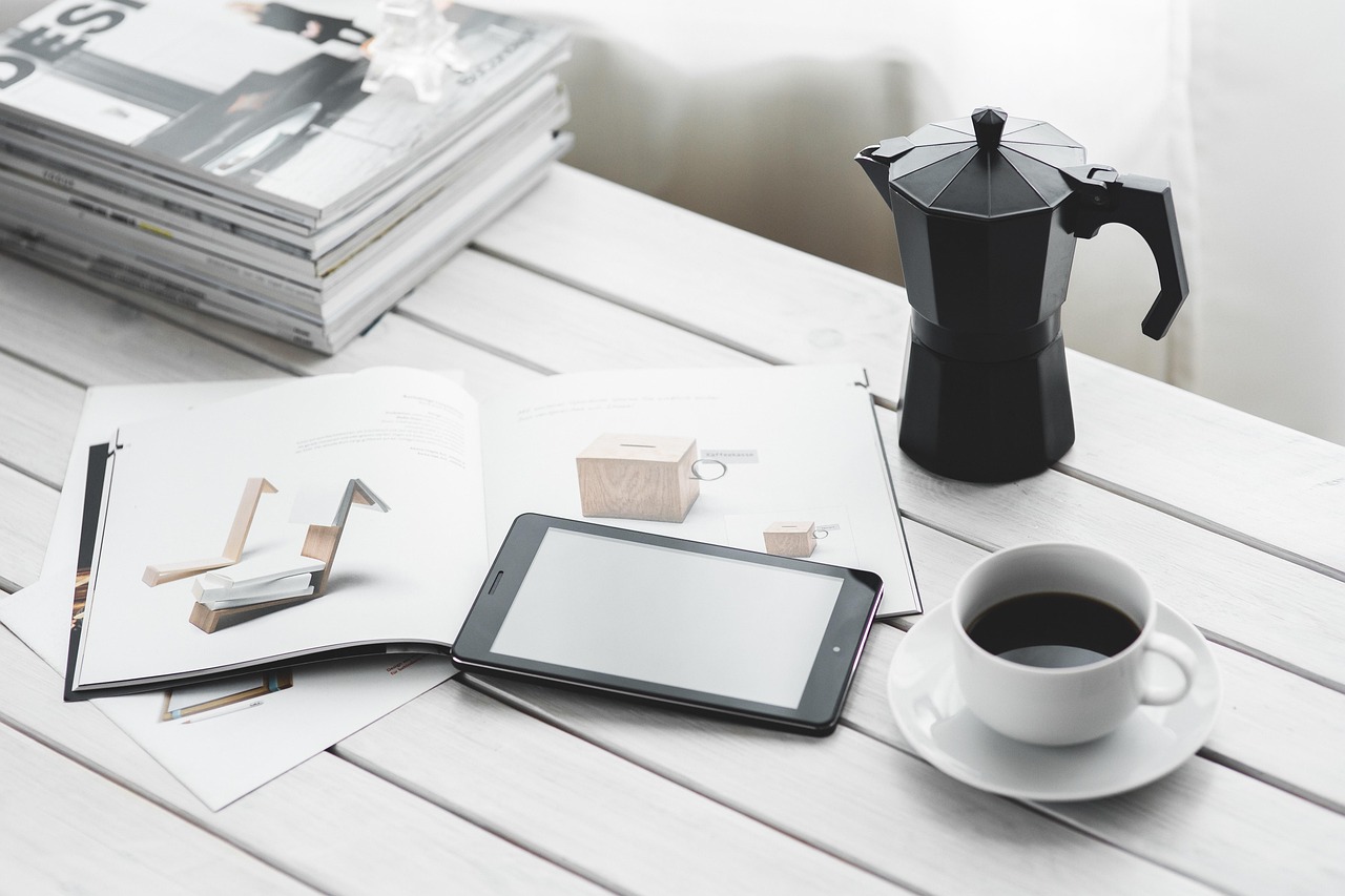 Technology, coffee cup, tablet — Rainbow International Restoration Reviews