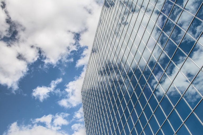 Building, reflection, clouds — Top Small Business Trends of 2019