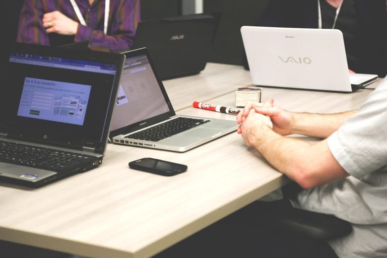 Laptops, meeting, businessmen — Understanding tezos