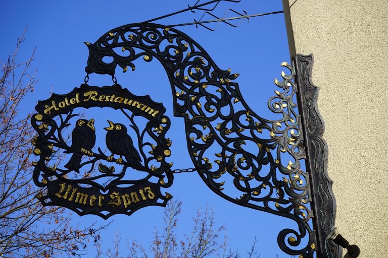 Nasal shield, inn sign, wrought ironwork — Weather-Resistant Commercial Tent Solutions