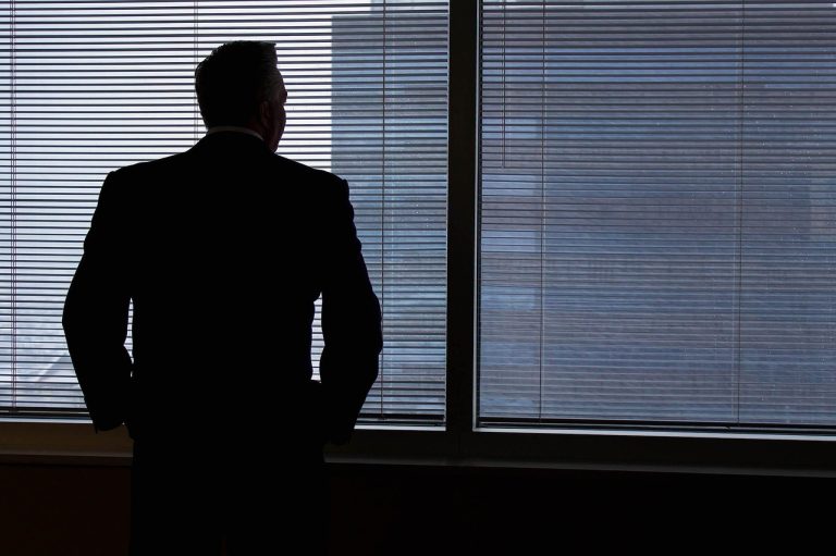 Businessman, silhouette, windows — What Businesses Need to Know About Modern Wax Technology