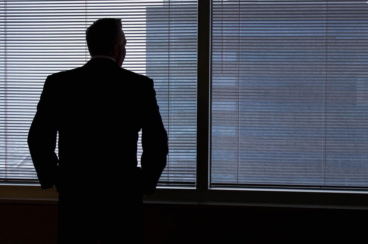 Businessman, silhouette, windows — What Businesses Need to Know About Modern Wax Technology
