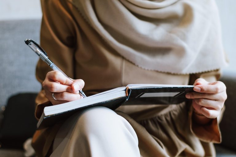 Muslim, woman, writing — What Is The Meaning Of Notarized Translation?